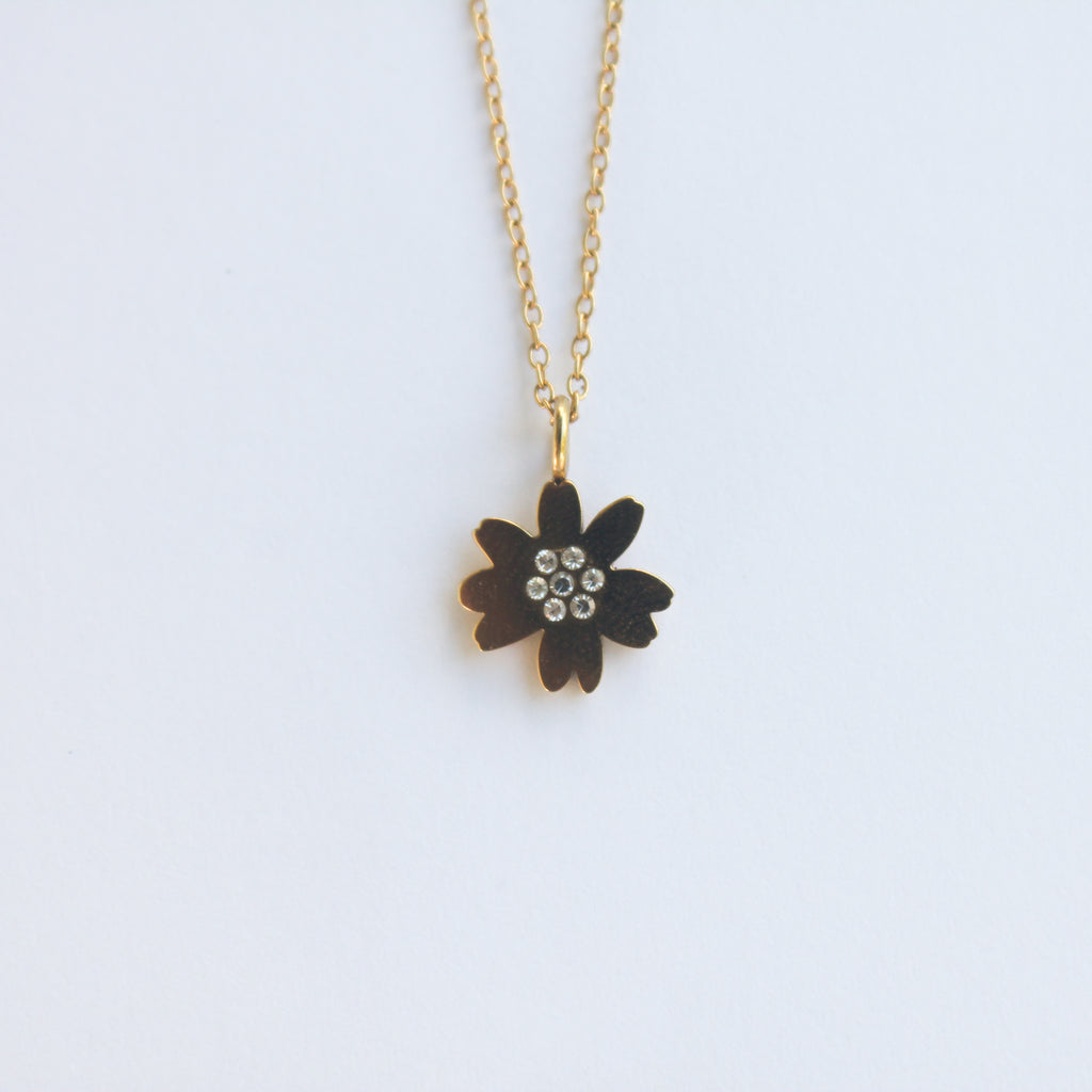 Gold necklace with a flower pendant