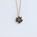 Gold necklace with a flower pendant